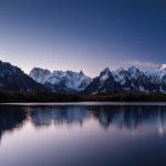 mount-mont-blanc-covered-snow-reflecting-water-evening-chamonix-france